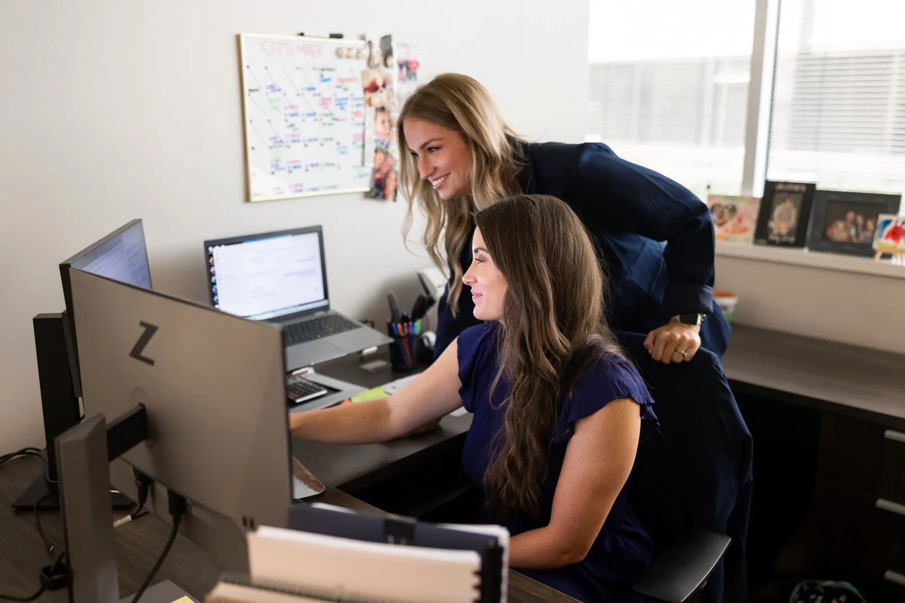 TMB advisors collaborating at a desk